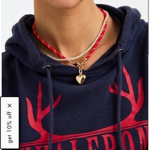 Roxanna Assoulin happy cord charm necklace